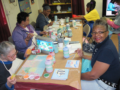 Frederick Douglass Senior Center artists at the Mural Mural on the Walls community workshop creating tiles for the New York Aquarium in Coney Island