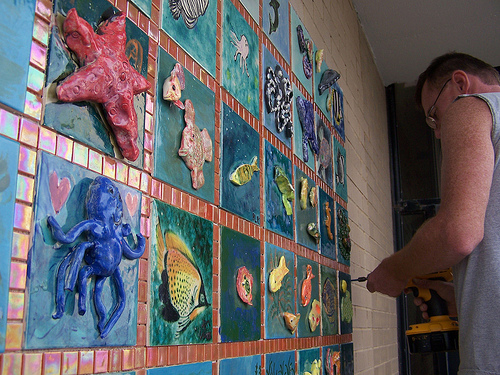 Patrick installing the first panel on the exterior wall of the New York Aquarium in Brooklyn, NY.