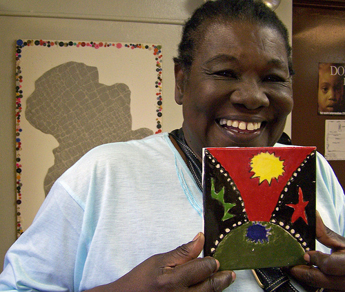 Odessa working on Glazing tiles for the Frederick Douglass Mural, installed at the NY Aquarium