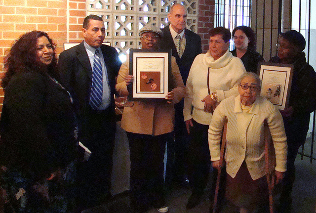 Ukah and Juan receiving a gift of appreciation